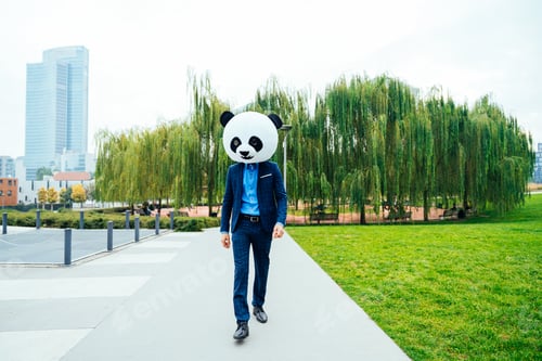 Preview: Storytelling image of a business man wearing a giant panda head