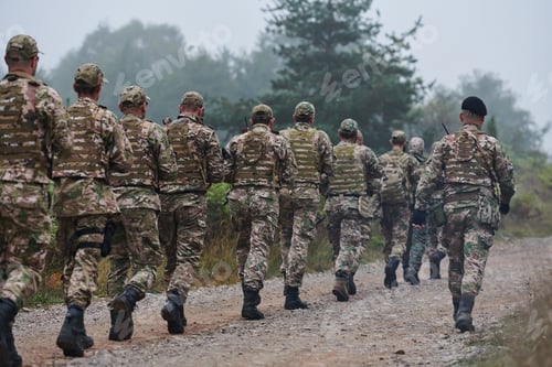 Preview: An elite military unit, led by a major, confidently parades through dense forest, showcasing