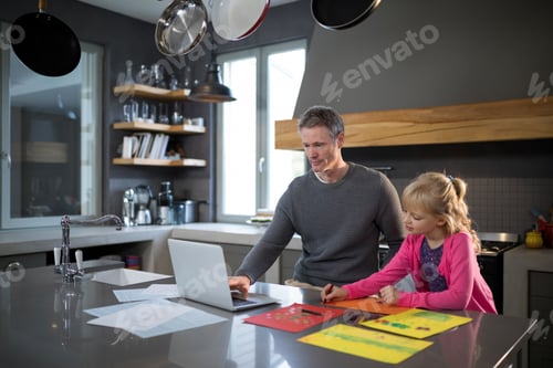 Preview: Father using a laptop while daughter is coloring