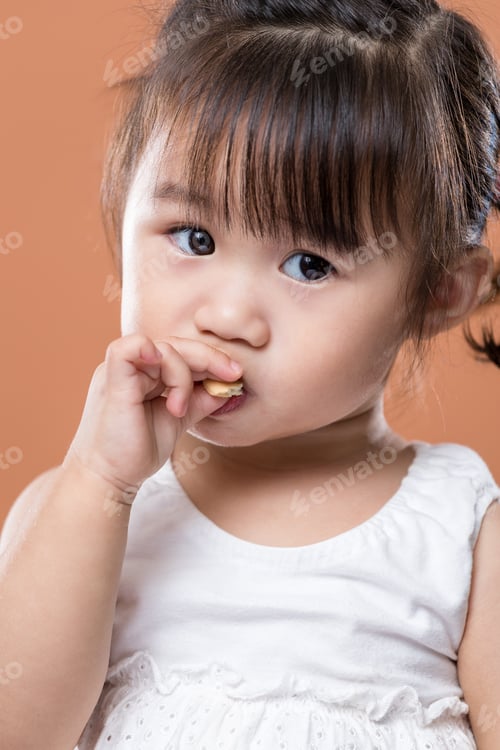 Preview: Cute baby girl eating snack