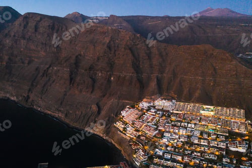 Preview: Top view of the houses located on the rock of Los Gigantes at sunset, Tenerife, Canary Islands
