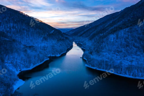 Preview: Aerial of a lake at winter during blue hour. Tarnita lake, Romania