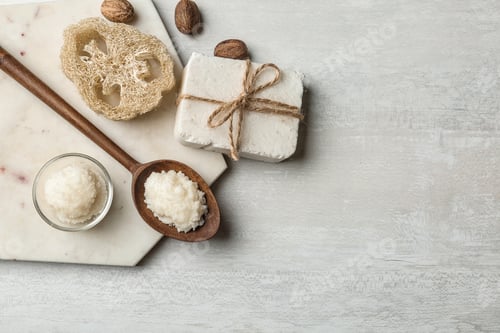 Preview: Flat lay composition with Shea butter and handmade soap on light background. Space for text