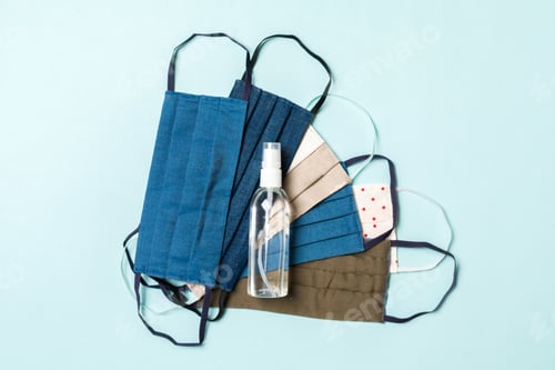Preview: Top view of personal protection such as a pile of homemade textile masks