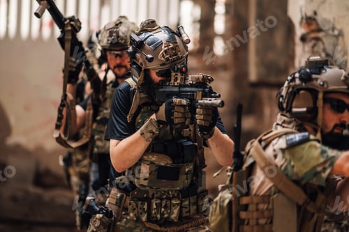Preview: Group of air soft fighters shooting with weapons at abandoned building