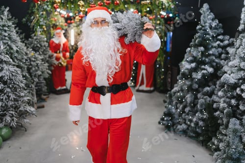 Preview: Santa claus carrying christmas tree for holiday shopping