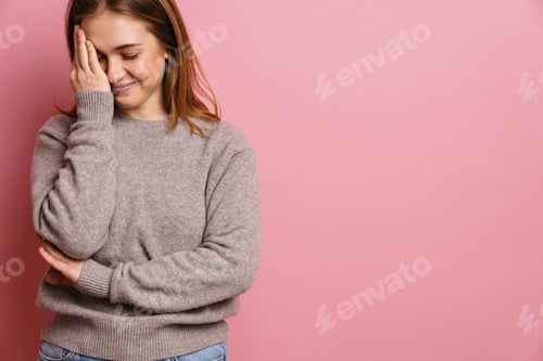 Preview: Young ginger happy woman smiling and covering her face