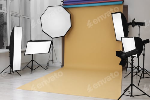 Preview: Interior of modern photo studio with professional lighting equipment