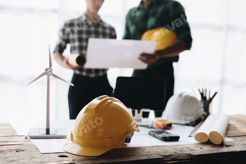 Preview: Engineer meeting for architectural project. working with partner and engineering tools on workplace.