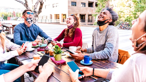 Preview: People having fun drinking latte outside at coffeehouse
