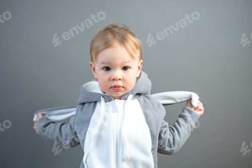 Preview: Pretty little caucasian girl 2 years old wearing bunny ears