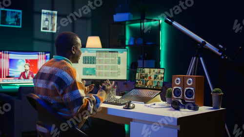Preview: African american man talking on video call using personal computer