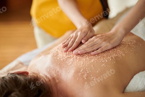 Preview: Masseuse Massaging Back of Woman