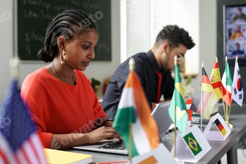 Preview: International students using gadgets at lesson