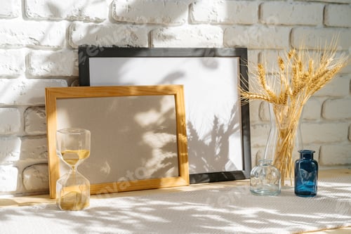 Preview: Photo frames on a brick wall background on the table with wheat ears in vase