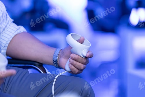 Preview: Closeup of male hands playing with virtual reality controllers, metaverse technology concept