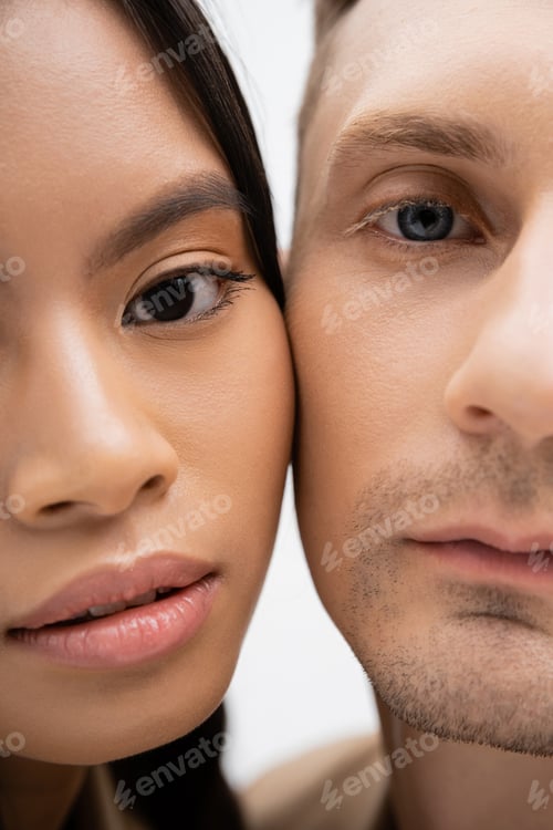 Preview: partial view of multiethnic romantic couple isolated on white