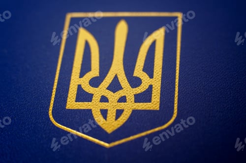 Preview: Large coat of arms of Ukraine close-up on a blue background, selective focus