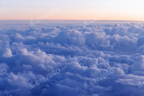 Preview: Sunset above the clouds from airplane