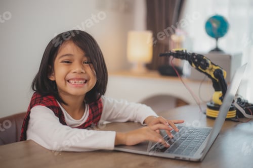 Preview: STEM education concept. Asian students learn at home by coding robot arms in STEM, mathematics engin