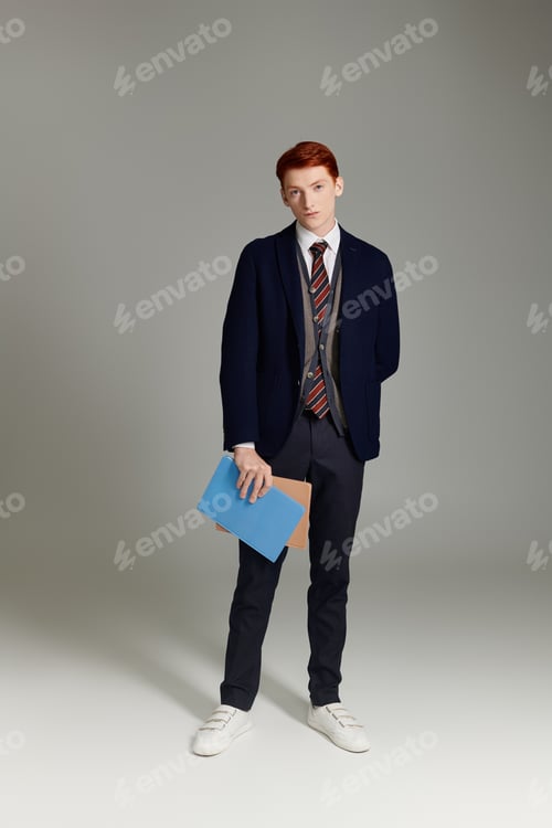 Preview: A stylish red-haired student poses confidently in a layered winter outfit