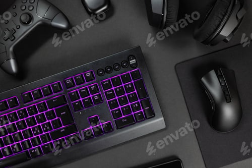 Preview: Purple lit keyboard surrounded by various modern wireless gadgets