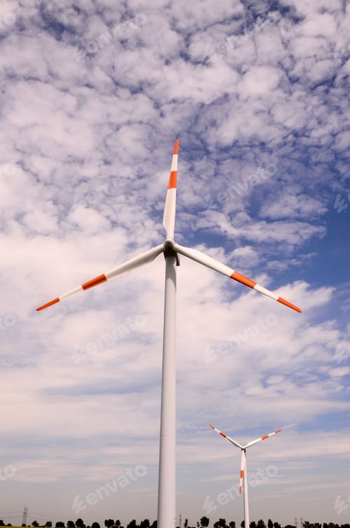 Preview: Windmill Turbine Renewable Green Energy Source against cloudy sky