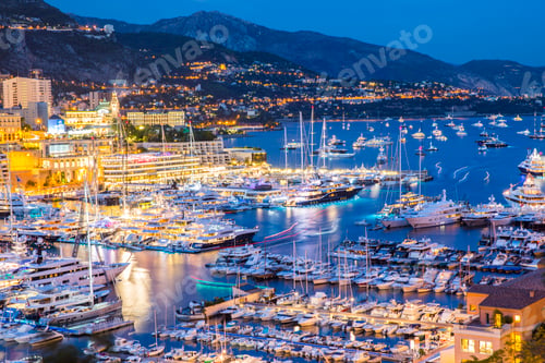 Preview: Elevated view of superyachts at Monaco yacht show at dusk