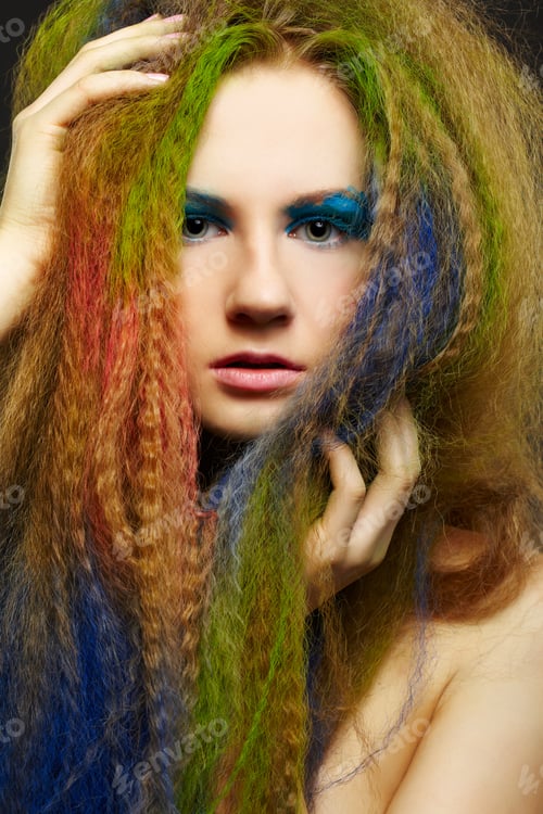 Preview: Headshot Portrait Of Young Beautiful Redhead Woman With Long Hair Colored With Green Red And Blue