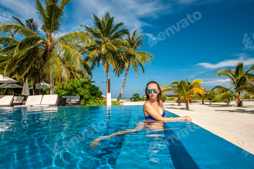 Preview: Woman At Beach Swimming Pool In Maldives
