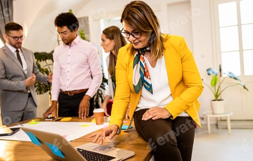 Preview: Group of business people working in office.