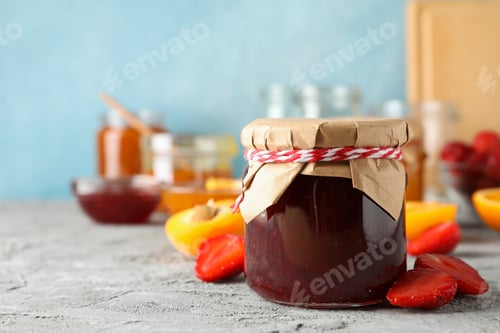 Preview: Composition with jam and ingredients on gray table, space for text