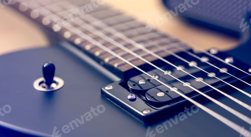 Preview: Photo of details of an electric guitar close up.