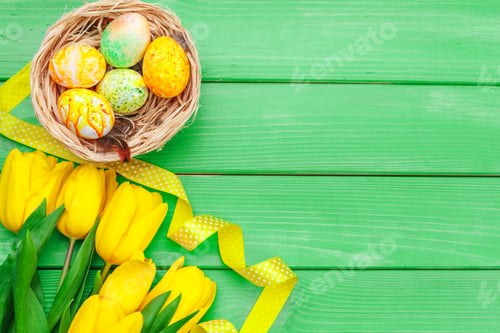 Preview: Beautiful Easter composition with decorated eggs and flowers on pastel wooden background