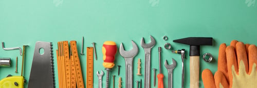 Preview: Construction tools on table, space for text
