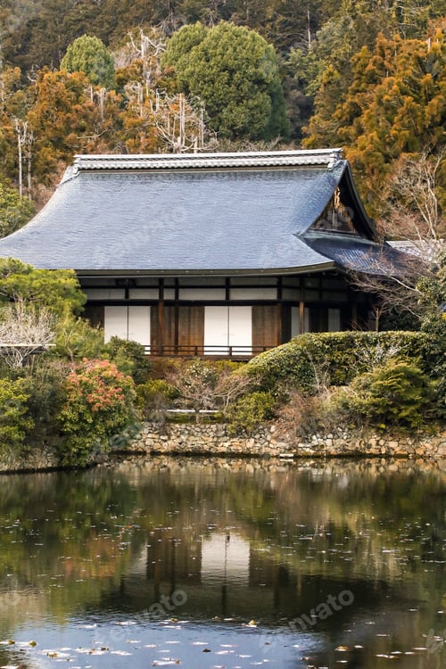 Preview: Traditional Japanese wooden architecture house surrounded by nature in autumn