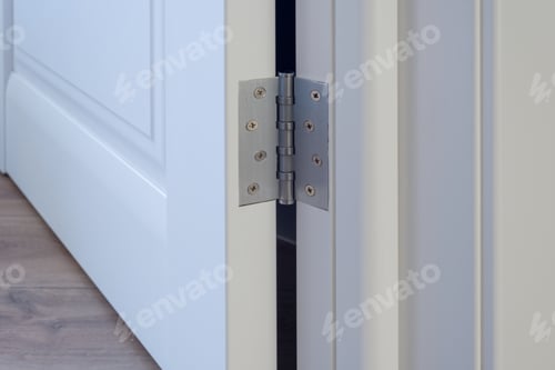 Preview: Metal chrome hinged hinges on a white interior door