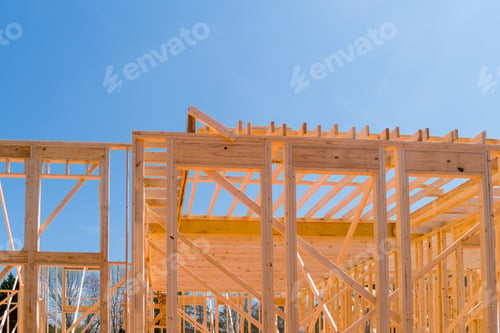 Preview: At the construction site there are beams of wood stick framing that will be used to construct a new
