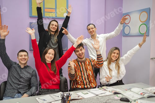 Preview: Group of happy students at language school class