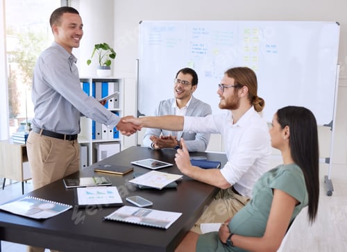 Preview: Shot of a diverse group of businesspeople shaking hands during a meeting in the office
