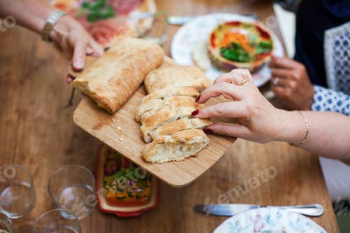 Preview: Three women having lunch together, at home, mid section