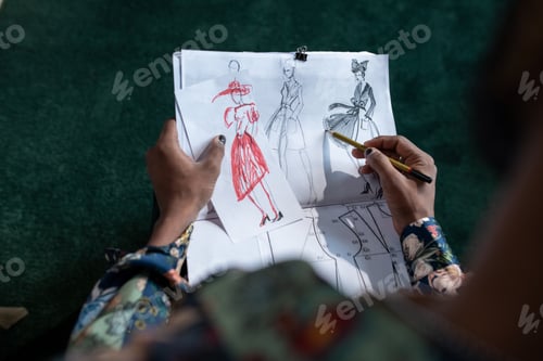 Preview: Fashion Designer Creating Sketches for New Collection