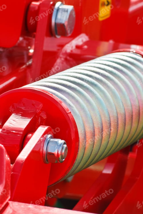 Preview: Hard silver spring made of steel. Part of big industrial or agricultural machine