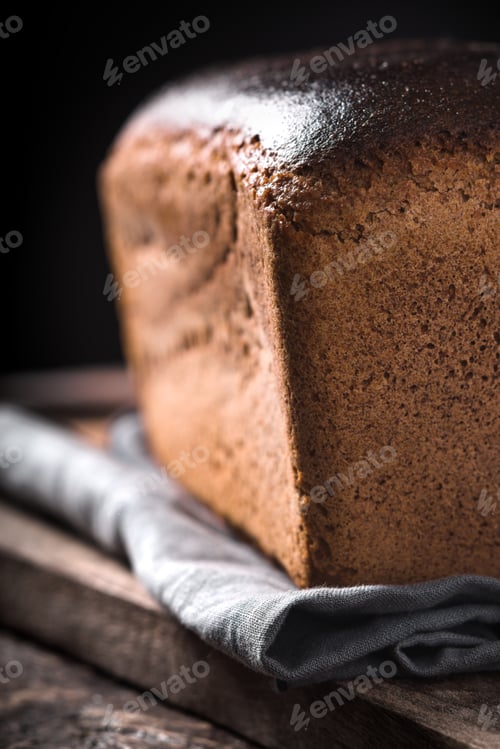 Preview: Rye bread on the wooden board vertical