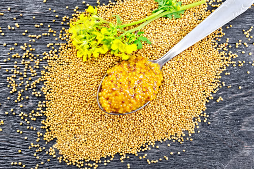 Preview: Sauce mustard Dijon in spoon with flower on board top