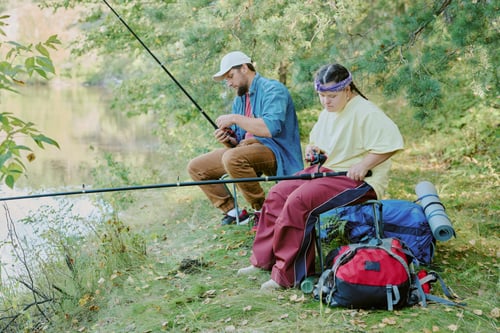 Preview: Young Man and Young Girl with Down Syndrome Fishing Together by Forest Lake Shore