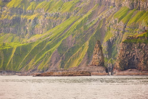 Preview: Green rocky mountain fjord landscape in Faroe islands. Vagar