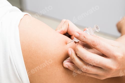 Preview: Series of medical doctor injecting vaccine into the arm of a patient