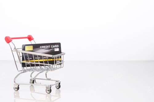Preview: Credit card in shopping cart on white-3
