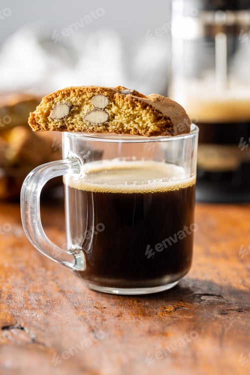 Preview: Coffee cup and italian cantuccini cookies. Sweet dried biscuits with almonds.